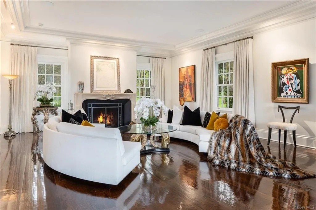 The beautiful Hudson River Estate living room with a cozy fireplace