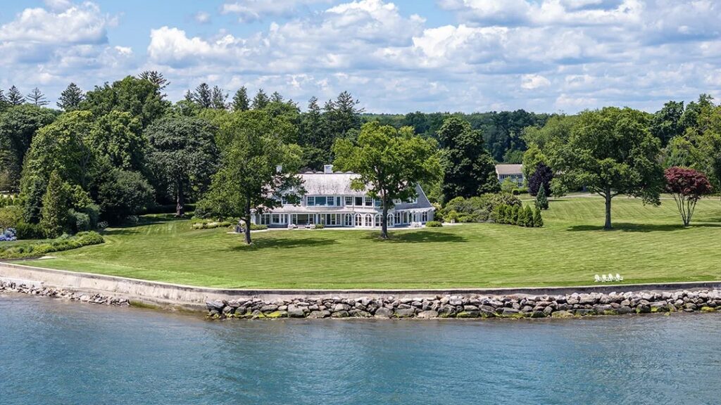 Nestled on a sprawling 6.6-acre parcel, the shingle-style mansion offers an unparalleled level of privacy and exclusivity. Its 400 feet of waterfront along the Long Island Sound create a serene backdrop for the property, while the meticulously landscaped grounds provide an oasis of tranquility.