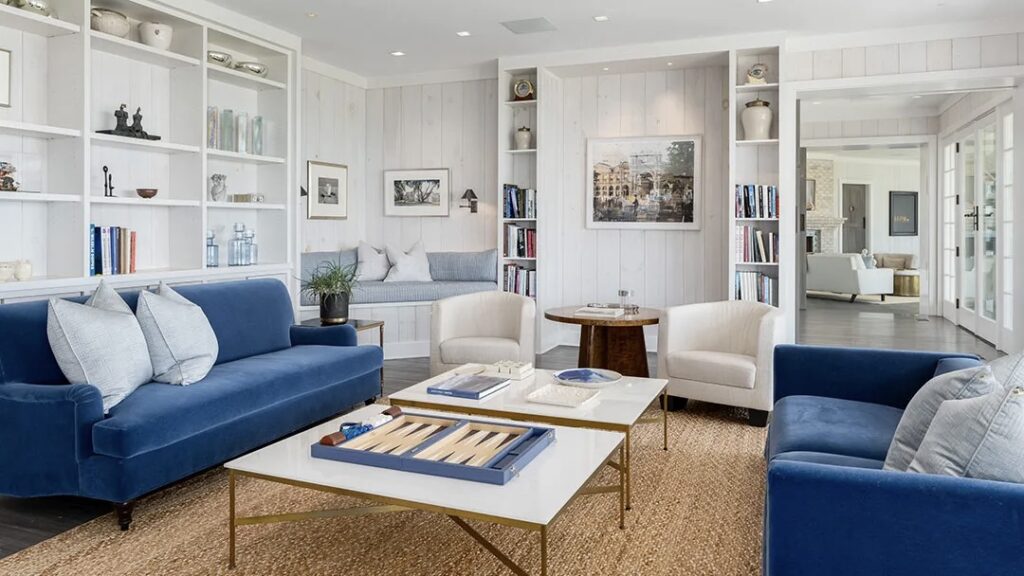 One of the sitting rooms. he meticulously designed interior boasts an impressive blend of classic and contemporary elements. Soaring ceilings and expansive windows create a sense of grandeur, while the use of natural materials and a neutral color palette fosters a feeling of warmth and sophistication.