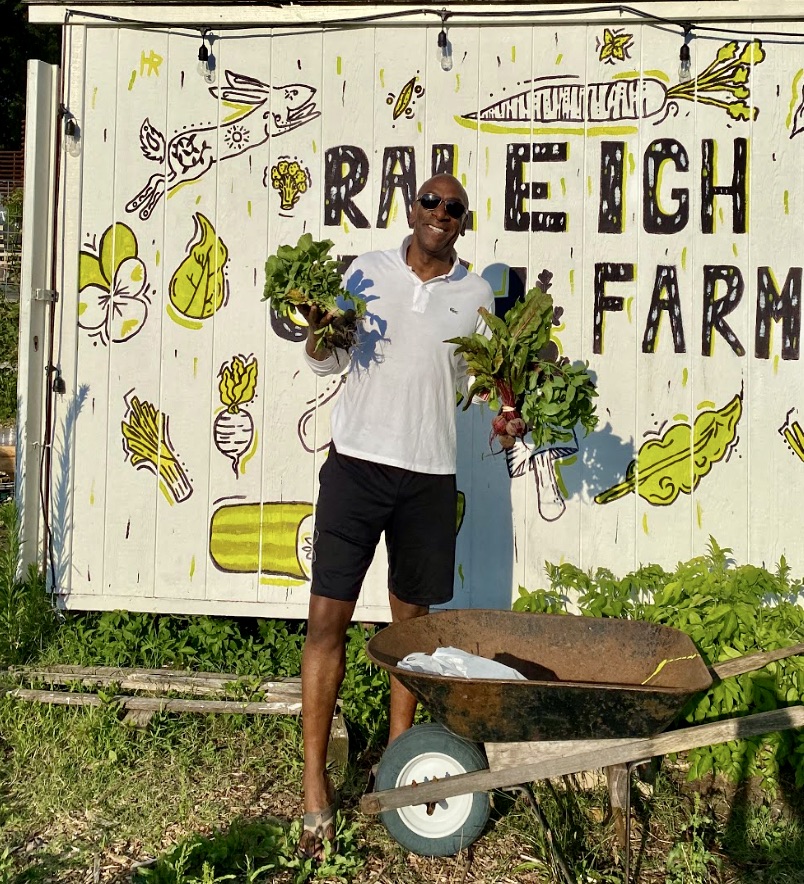 Meet Board Member Ivan Hovis Gobern
On your next trip to the Raleigh City Farm (RCF), you might see a tall, really energetic African American man with a huge smile quietly standing in line at Farmstand, greeting strangers or pulling weeds. Meet Ivan Hovis Gobern, a volunteer whose activities run the gamut from being an RCF board member to supporting programs, stepping in to help with fundraising or just playing in the dirt. Ivan has been a regular fixture on the RCF board for five years.